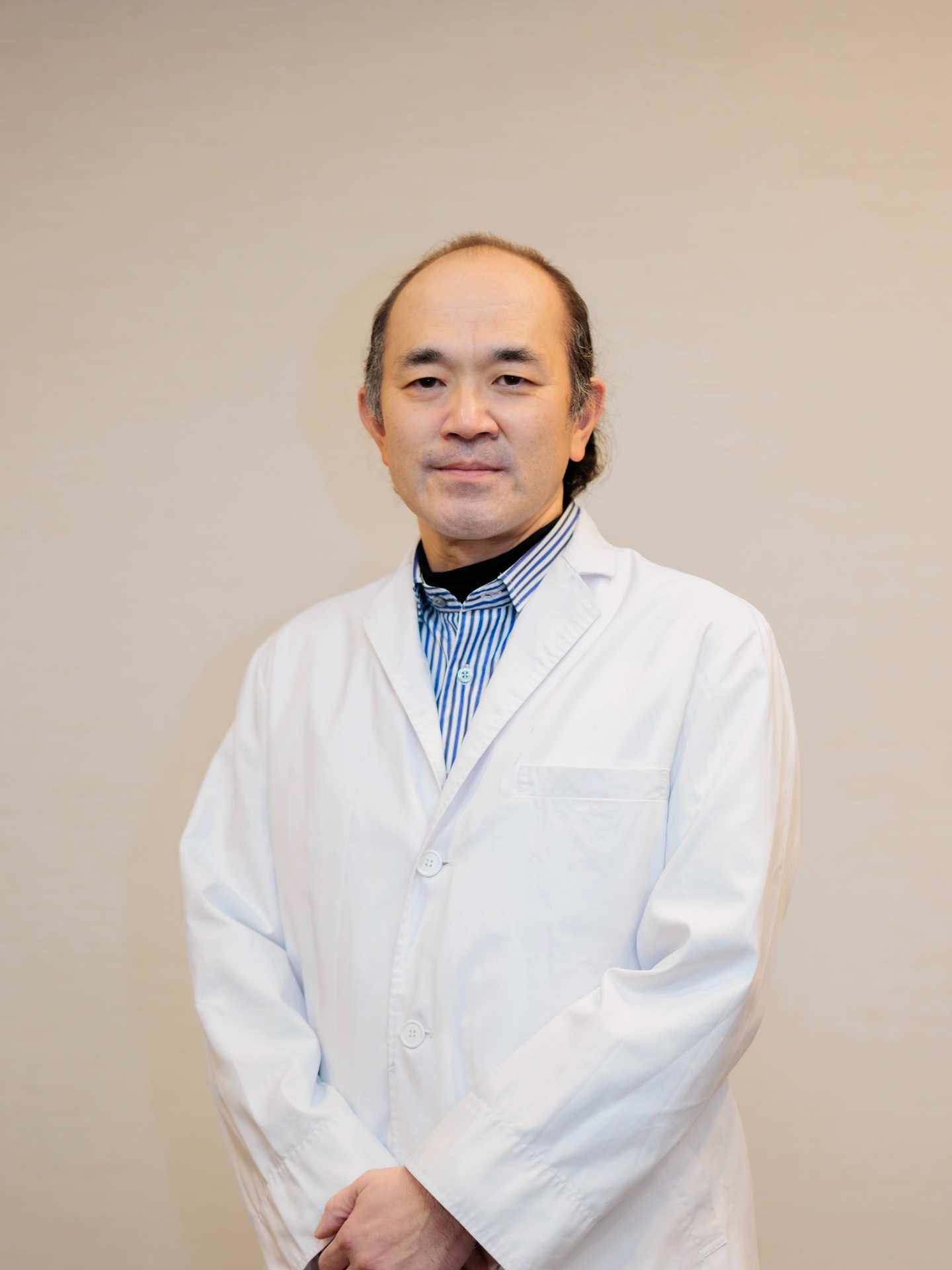 長尾 賢治
